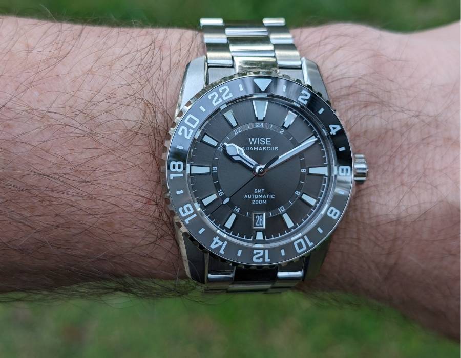 WISE ADX 110 True GMT automatic watch with stainless steel bracelet shown on wrist for case and wearability review